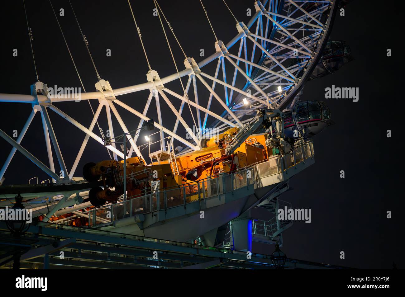 LONDON - April 21, 2023: Get a closer look at the London Eye's intricate drive mechanism in stunning illuminated detail, showcasing the precision and Stock Photo