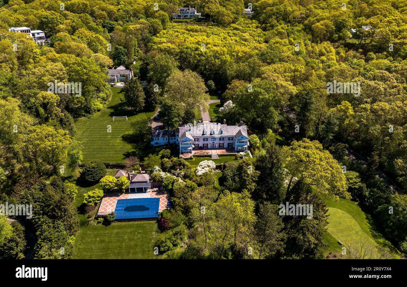 An aerial view over a large house on Long Island, New York on a sunny