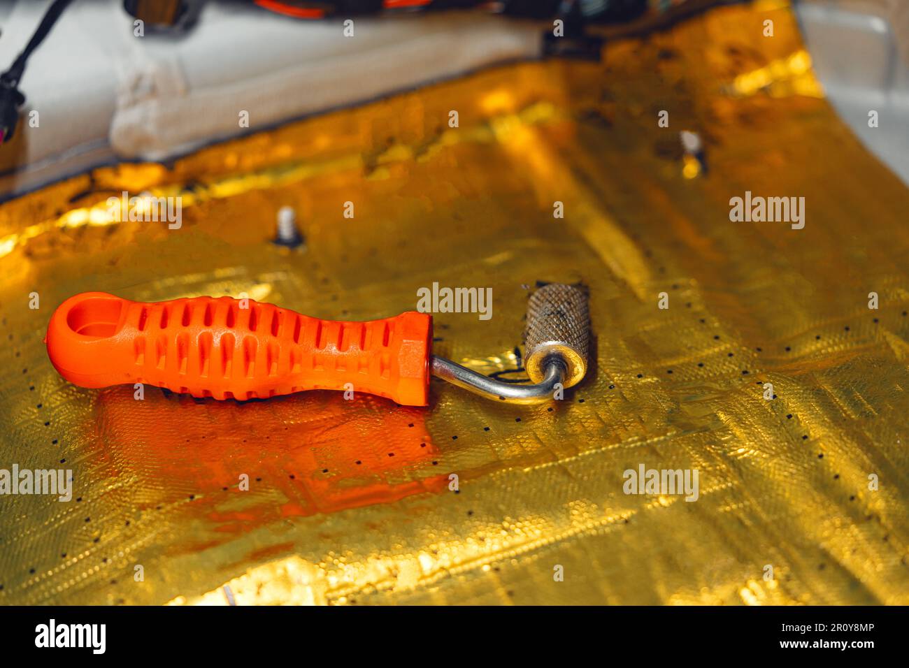 Process of installation car soundproofing material in car service Stock