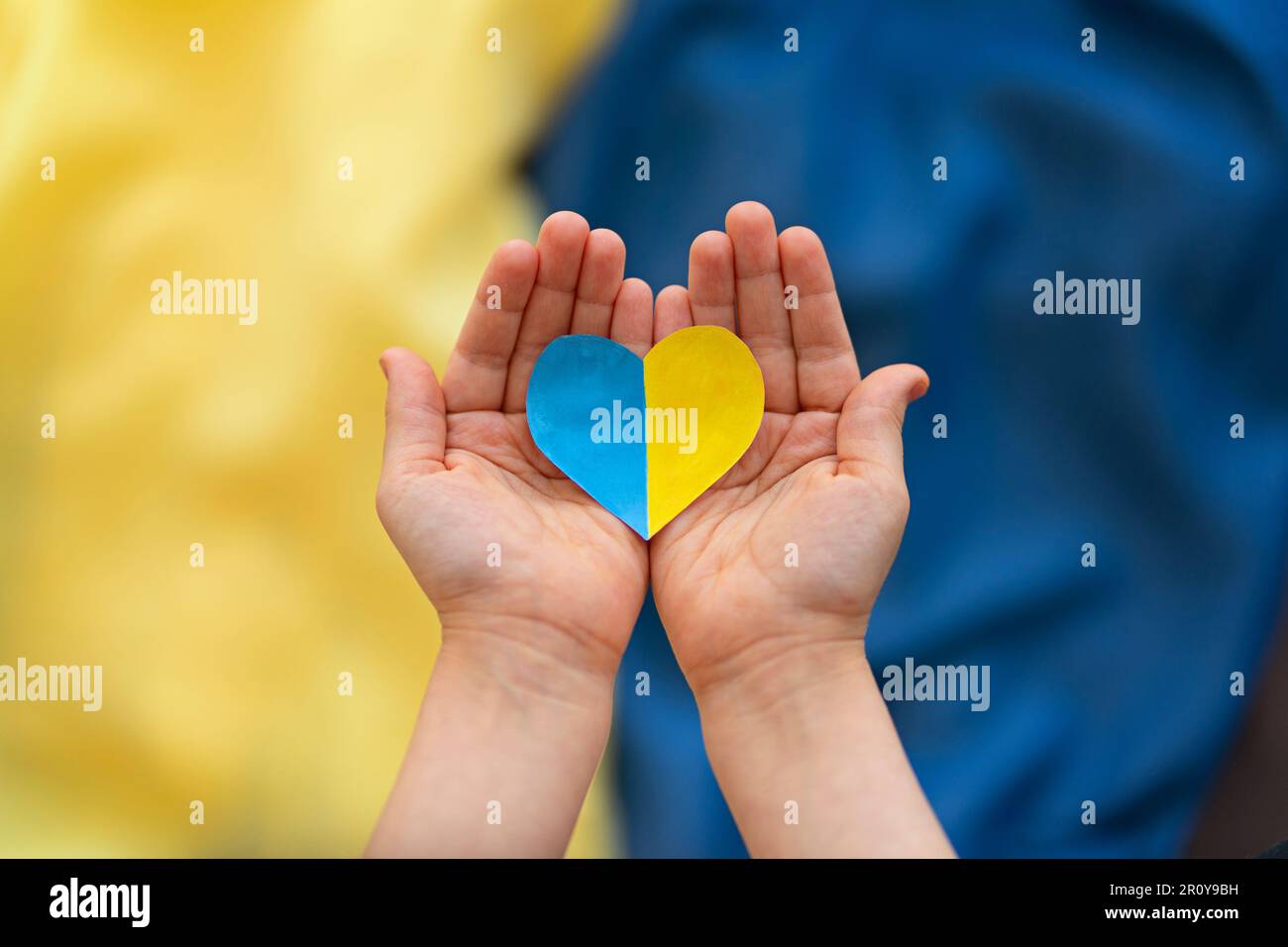 A heartshaped badge depicting the State Flag of Ukraine as a symbol of