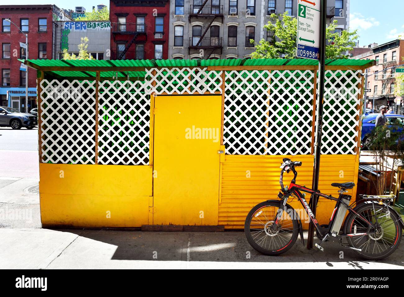 Electric bicycle close to a Closed Café Restaurant Terrace - Street Scene New York City - USA Stock Photo