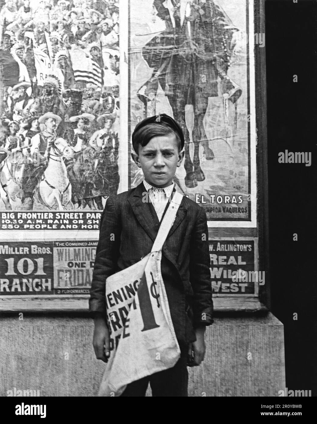 Twelve year old S. Russell is a newsboy in Wilmington,Delaware and has been selling newspapers for two years. His average earnings are 20 cents daily. The boy deposits earnings in du Pont Savings Bank, and on Saturday night works for Reynold's candy shop, delivering packages.  Works 5 hours daily, except Saturday, when he works 11. Circa 1910 . Photograph by Lewis Wickes Hine (1874-1940) Stock Photo