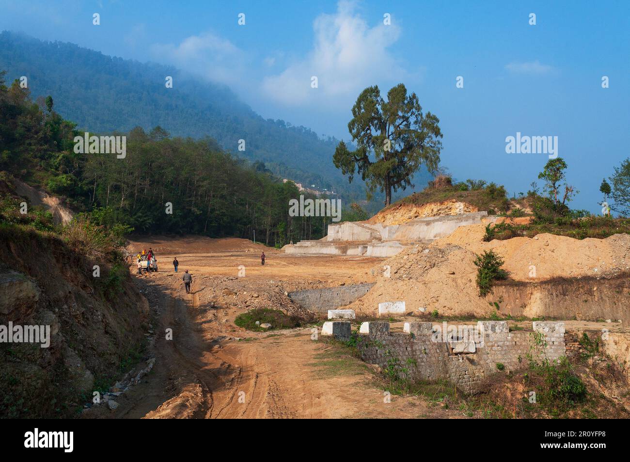 High altitude playground and stadium is being made by cutting tree and levelling Himalayan soil, Environmental damage to Himalayan mountains. Stock Photo