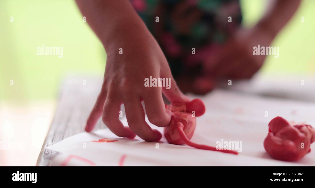 Child girl playing with play dough Stock Photo - Alamy