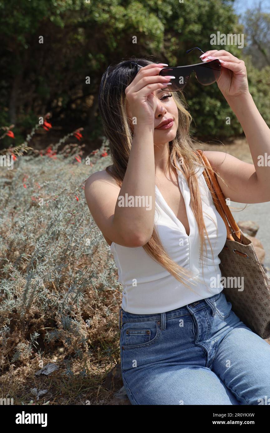 Photo of beautiful lady in a park on a summer day Stock Photo - Alamy