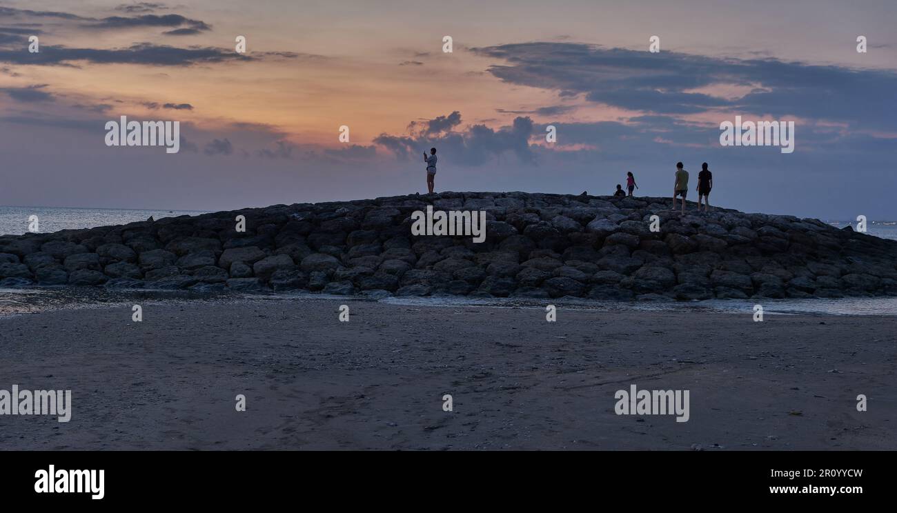 Pantai Jerman (German Beach) in Kuta, Bali Indonesia sunset shot showing  people enjoying the beach Stock Photo