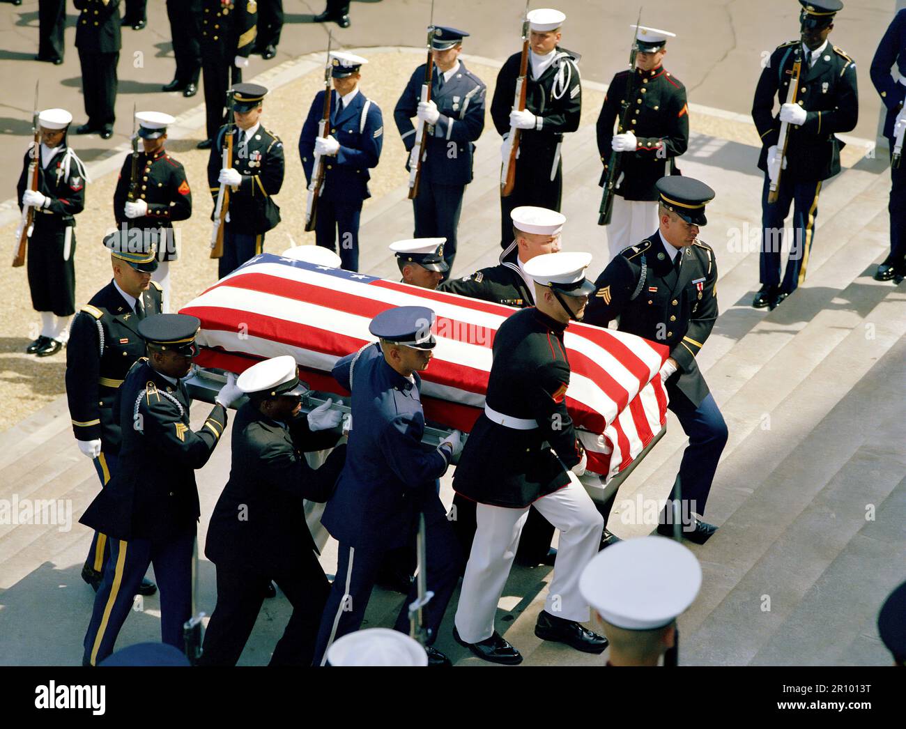 A joint services casket team carries the Unknown Serviceman of the Vietnam Era up the Capitol steps into the rotunda.  The Unknown will lie in state until May 28th.  A state funeral service will be held in the Memorial Amphitheater of Arlington National Cemetery followed by internment at the Tomb of the Unknowns. Stock Photo