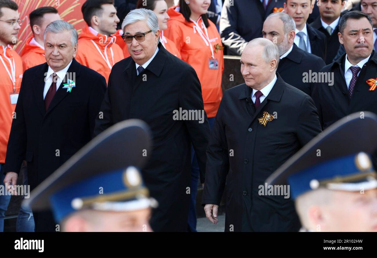 Moscow, Russia. 09th May, 2023. Russian President Vladimir Putin, right, arrives with Kazakh President Kassym-Jomart Tokayev, center, and Uzbek President Shavkat Mirziyoyev for the annual Victory Day military parade through Red Square, marking the 78th anniversary of the victory over Nazi Germany in World War Two, May 9, 2023 in Moscow, Russia. Credit: Gavriil Grigorov/Kremlin Pool/Alamy Live News Stock Photo