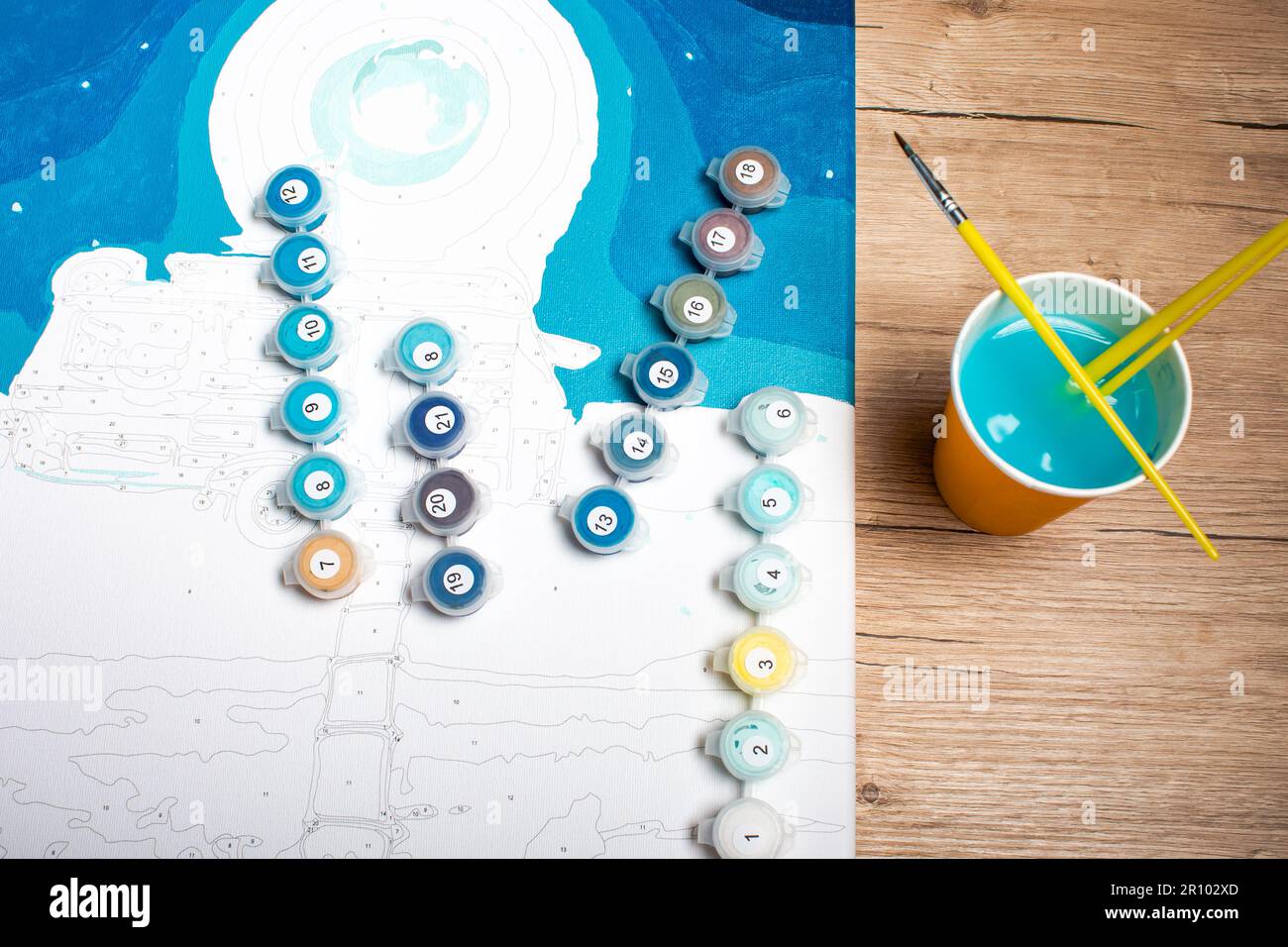 Painting by numbers. Set to paint the picture, includes a canvas, paints of  different colors, brushes. Top view Stock Photo - Alamy
