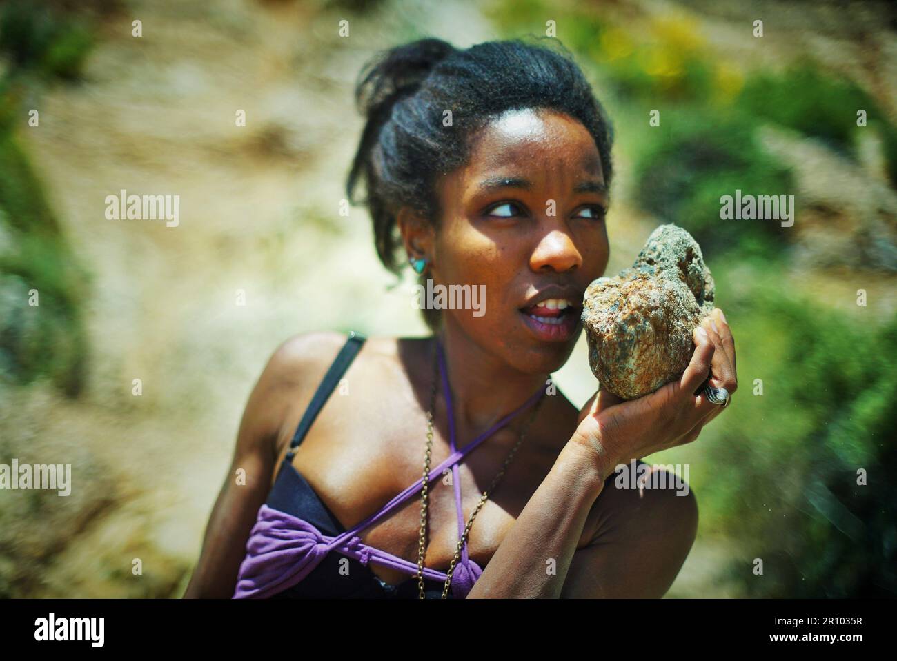 Woman Stranded Beautiful Black woman in purple clothing stranded on a desert island ...