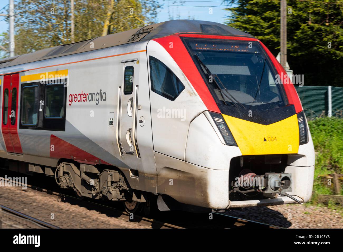 British Rail Class 745 FLIRT train of Greater Anglia near Margaretting heading towards London Liverpool Street, UK. Modern Intercity electrified EMU Stock Photo