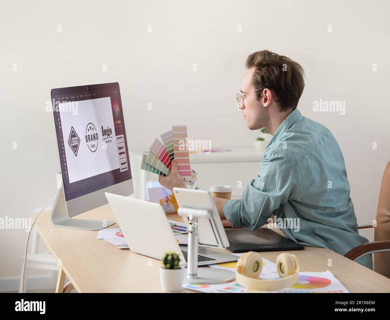 Male graphic designer developing logotype in office Stock Photo