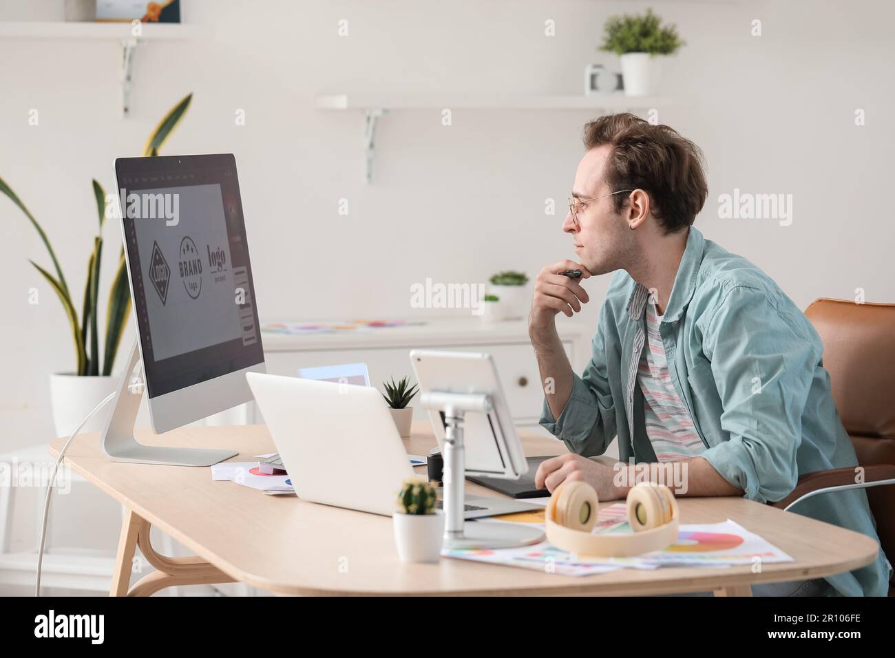 Male graphic designer developing logotype in office Stock Photo