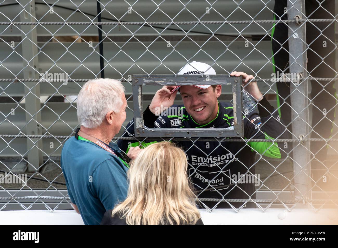 Winner Nick Cassidy (Envision Racing) talks to familiars on the finish line The winner of the 6th edition of the FIA ABB Formula E World Championship was Nick Cassidy of Envision Racing Team. It was his second consecutive triumph in his career. Stock Photo