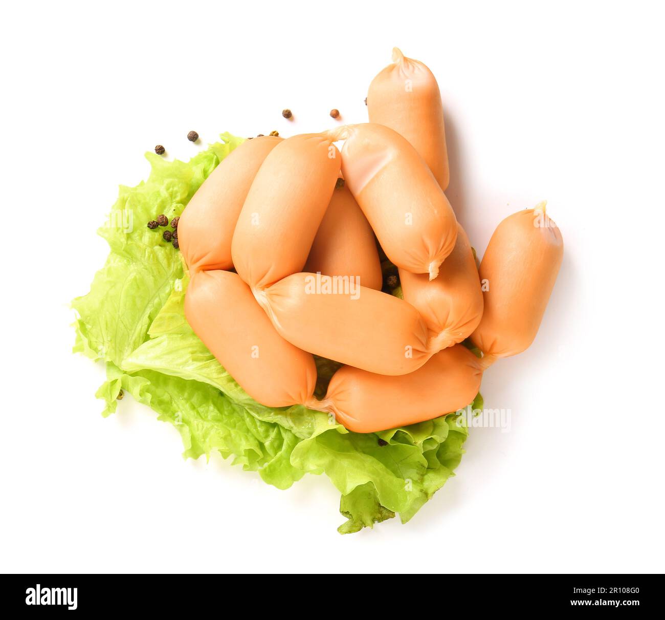 Tasty boiled sausages with lettuce and peppercorn on white background Stock Photo