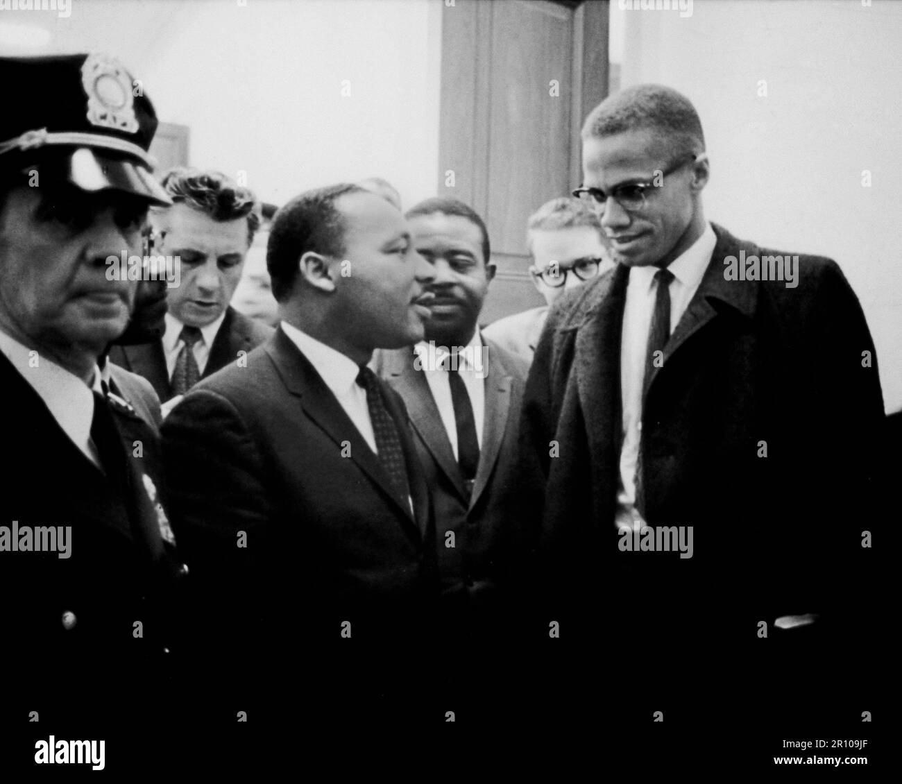 TITLE:  [Martin Luther King and Malcolm X waiting for press conference]..CALL NUMBER:  USN&WR COLL - Job no. 11695, frame 27  [P&P]..REPRODUCTION NUMBER:  LC-USZ6-1847 (b&w film copy neg.).No known retrictions on publication...MEDIUM:  1 photographic print...CREATED/PUBLISHED:  [1964 March 26]..CREATOR:..Trikosko, Marion S., photographer...NOTES:..U.S. News & World Report Magazine Photograph Collection...SUBJECTS:..King, Martin Luther, Jr., 1929-1968--Public appearances..X, Malcolm, 1925-1965--Public appearances...FORMAT:..Photographic prints 1960-1970...REPOSITORY:  Library of Congress Prints Stock Photo