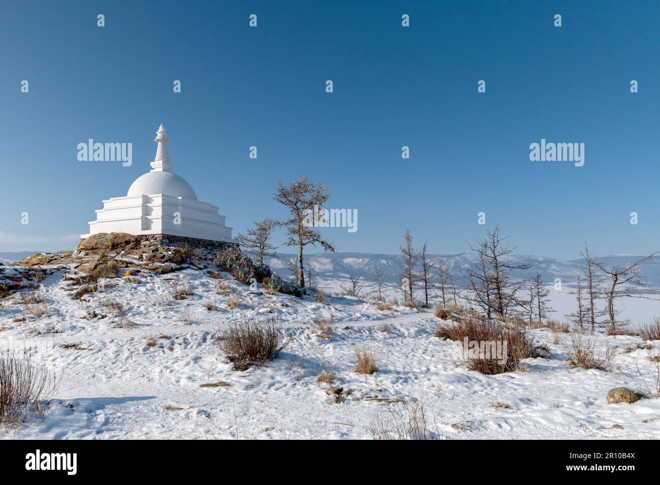 Ogoy Island, Baikal Lake, Russia- White Buddhist stupa and the baikal lake Stock Photo