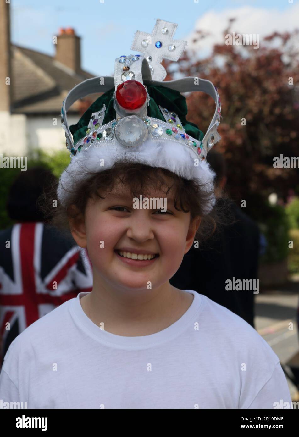 Portrait of a Young Girl wearing Crown at Street Party Celebrating King Charles III Coronation  Surrey England Stock Photo