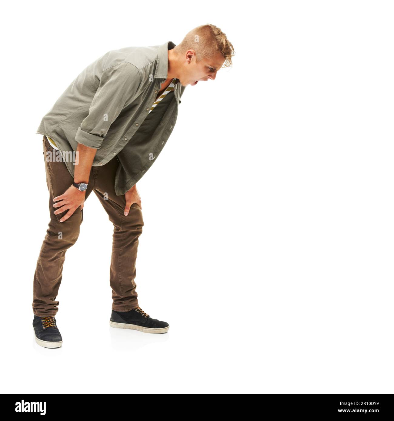 Screaming into copyspace. A full length studio shot of a man motioning ...