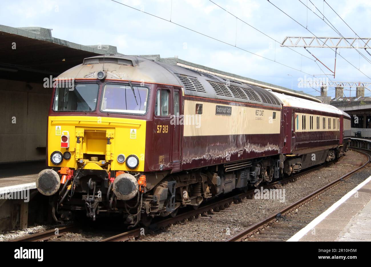 West Coast Railways class 57 diesel-electric loco 57313, Scarborough Castle, at rear of Northern Belle empty stock movement Carnforth 10th May 2023. Stock Photo