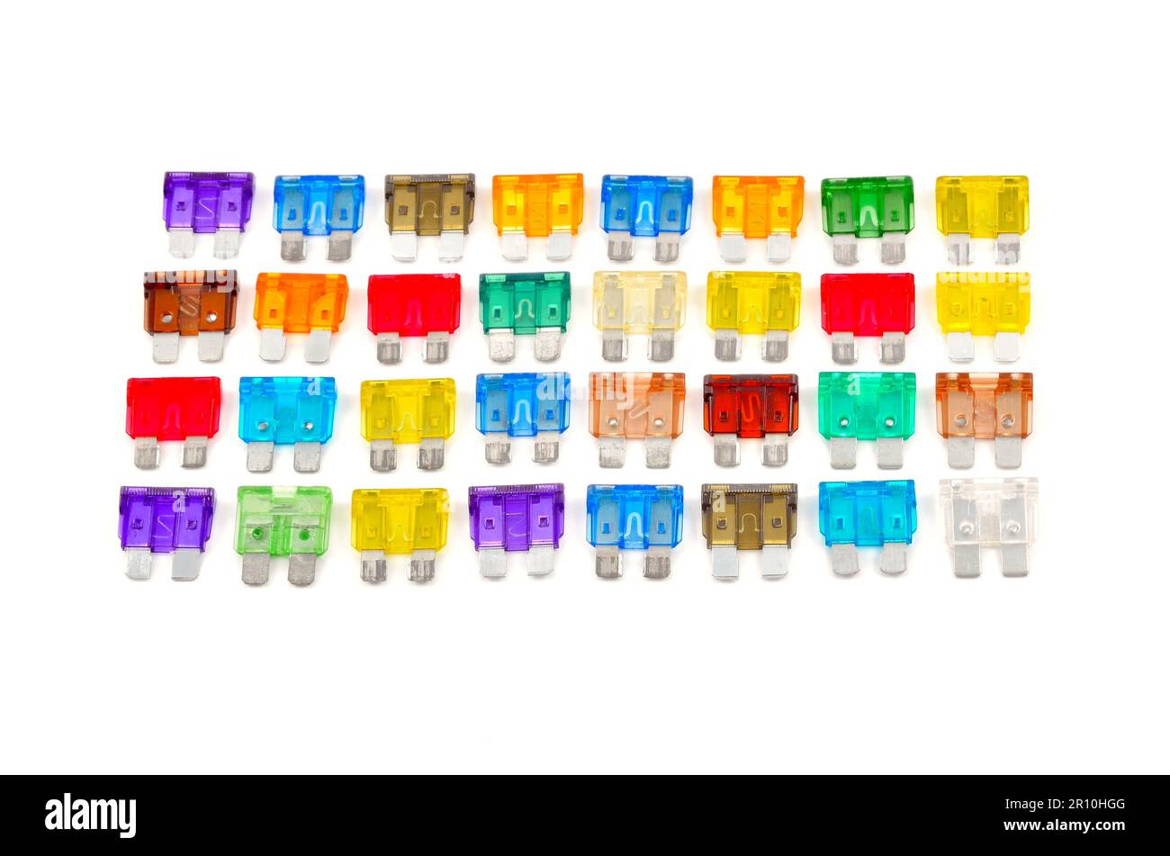 Coloe car fuse. Top view of colorful electrical automotive fuses or circuit breakers isolated on white background. Stock Photo