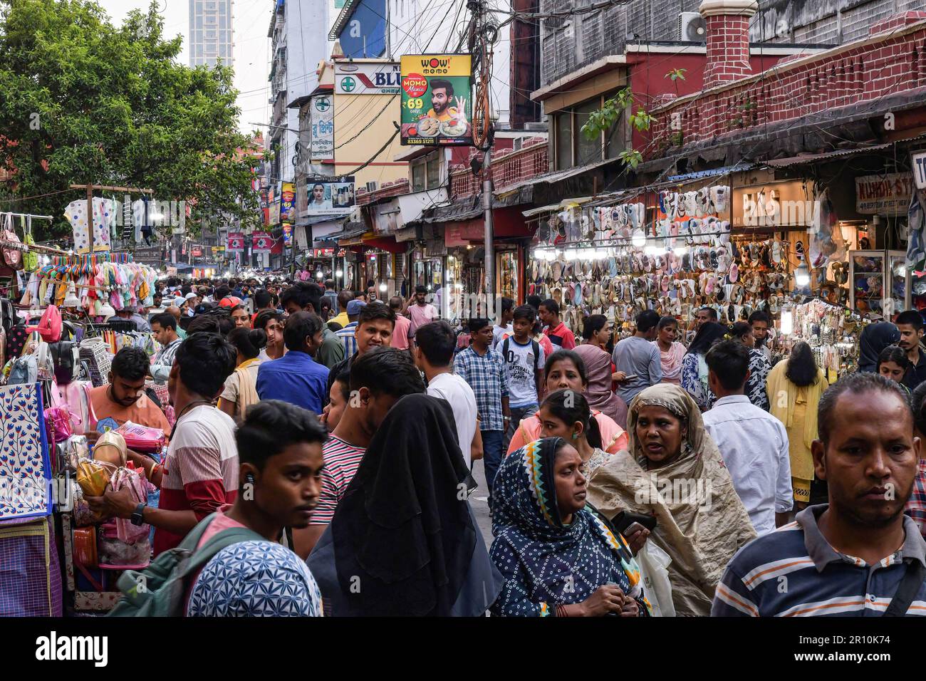 People seen shopping at a crowded market in Kolkata. India's population