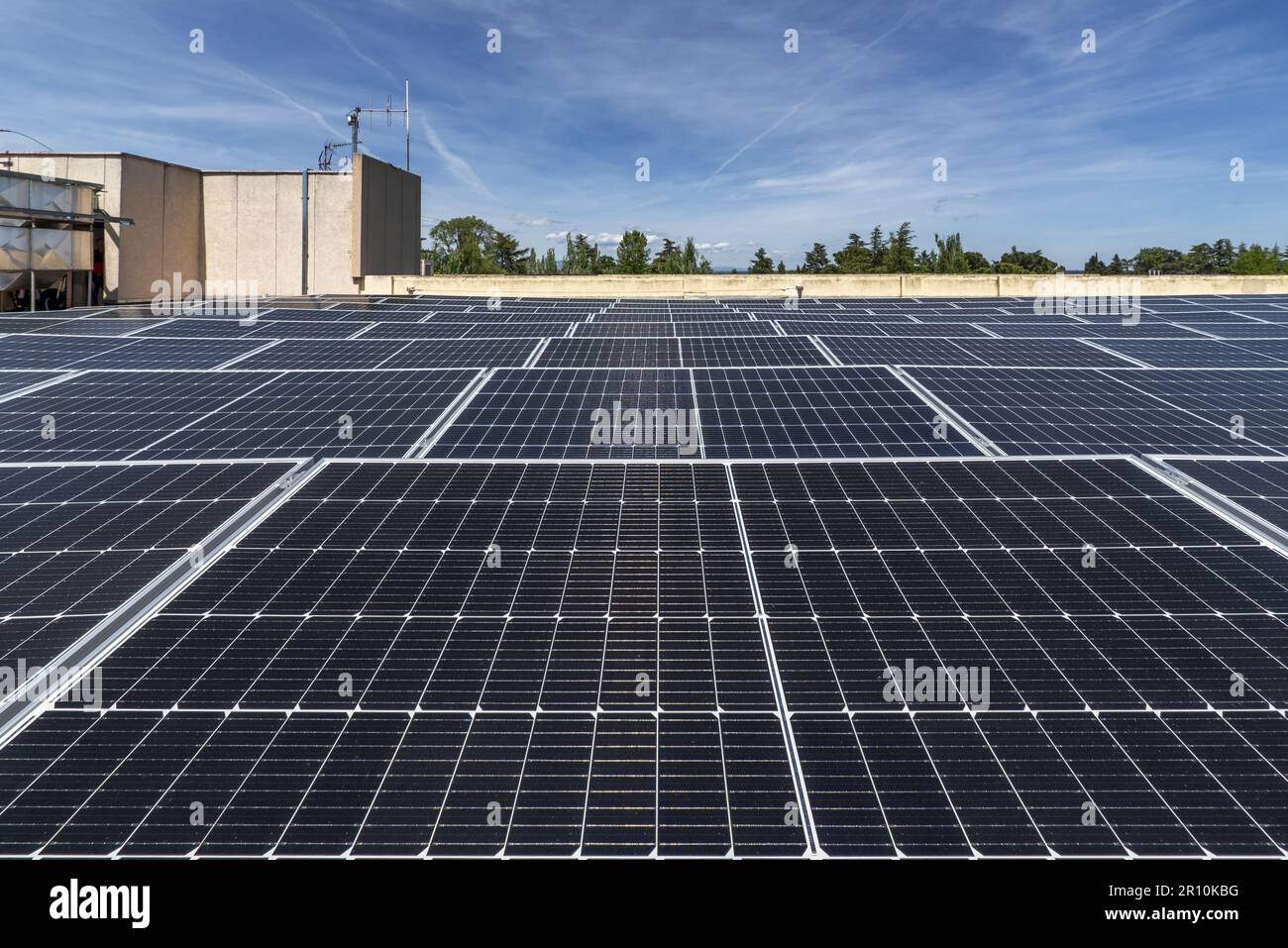 Surface of a penthouse terrace covered with solar panels to get clean energy Stock Photo