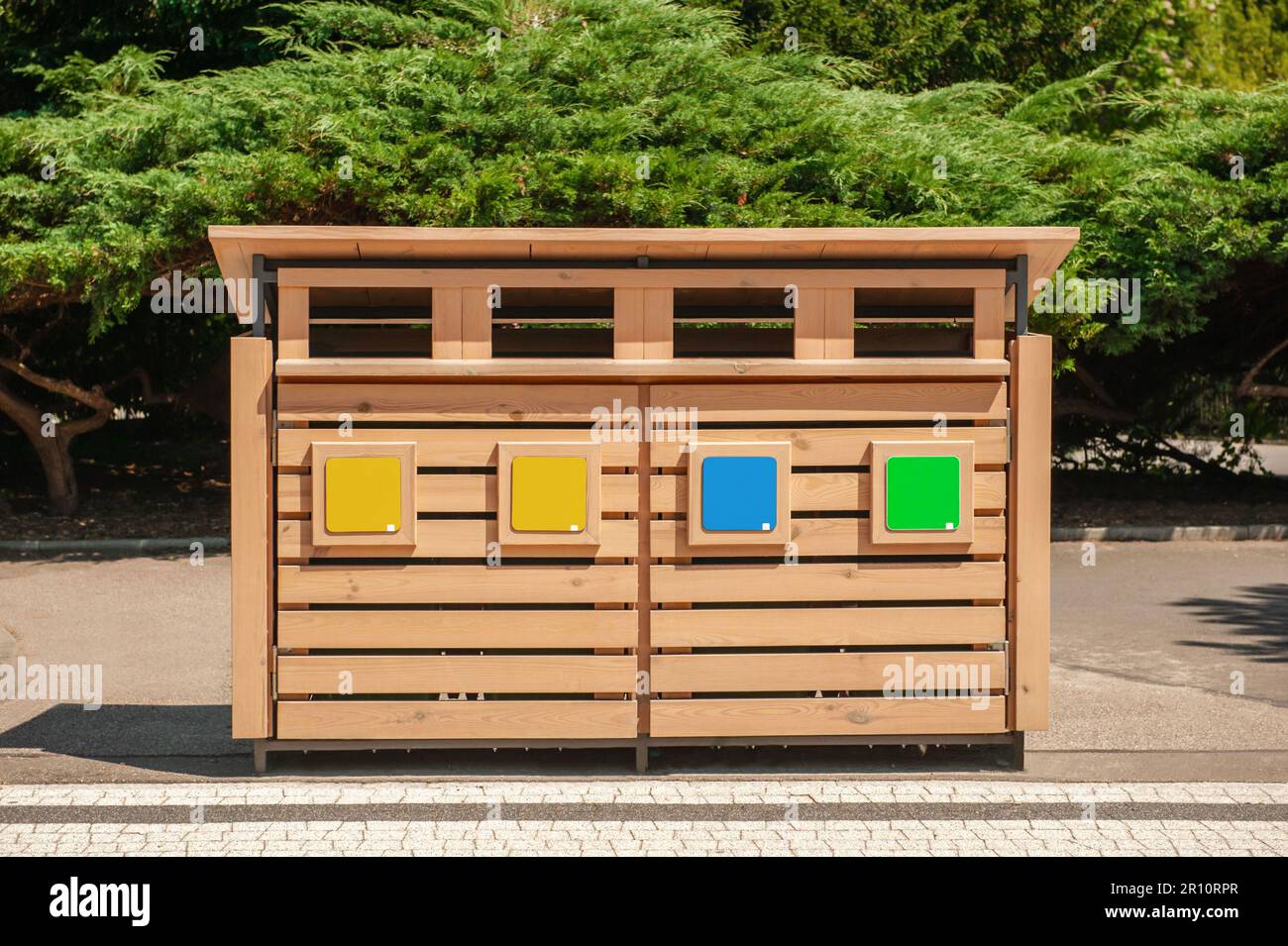 Wooden recycling bins for waste sorting outdoors Stock Photo - Alamy
