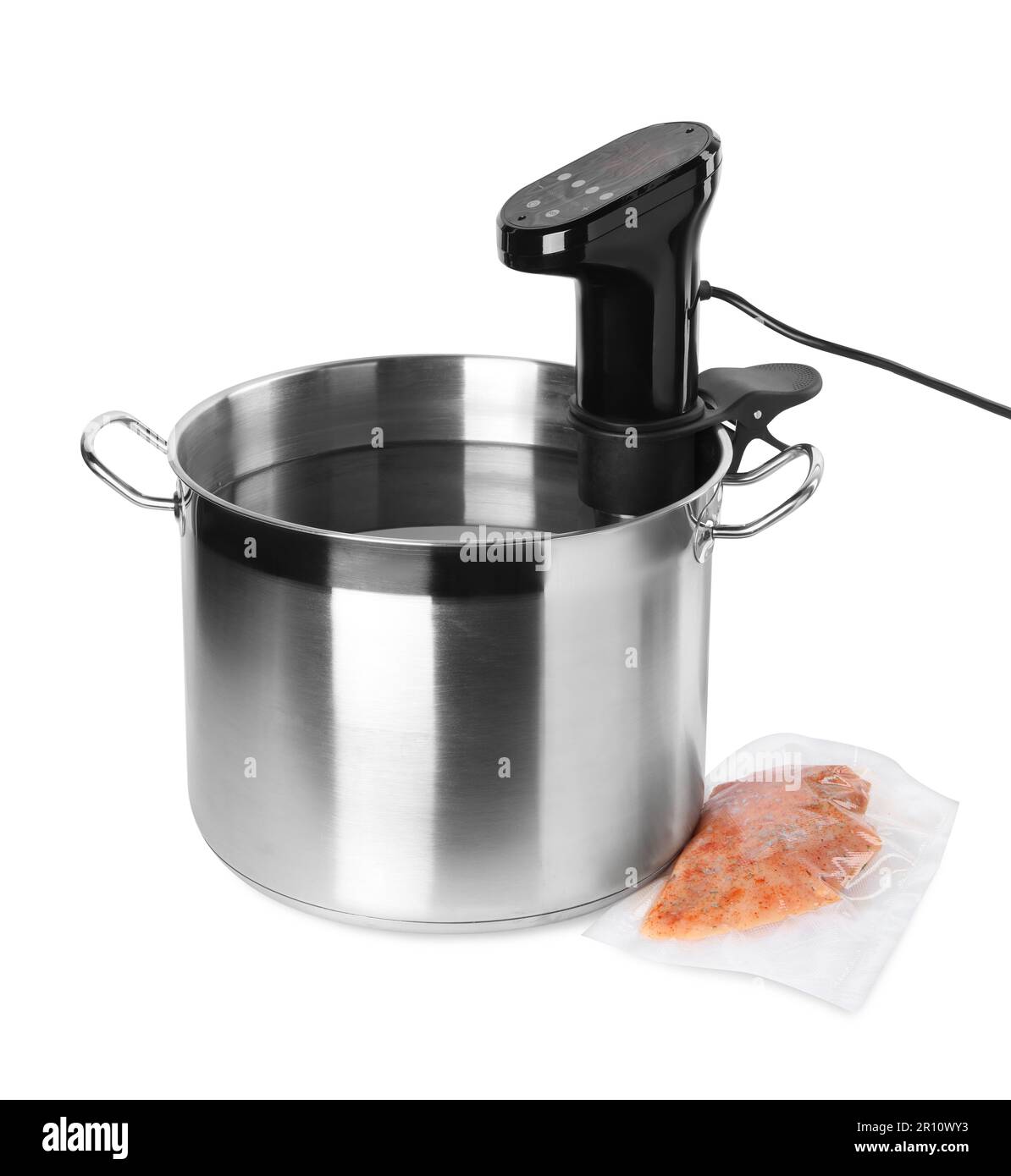 Thermal immersion circulator in pot and meat on white background. Vacuum packing for sous vide
