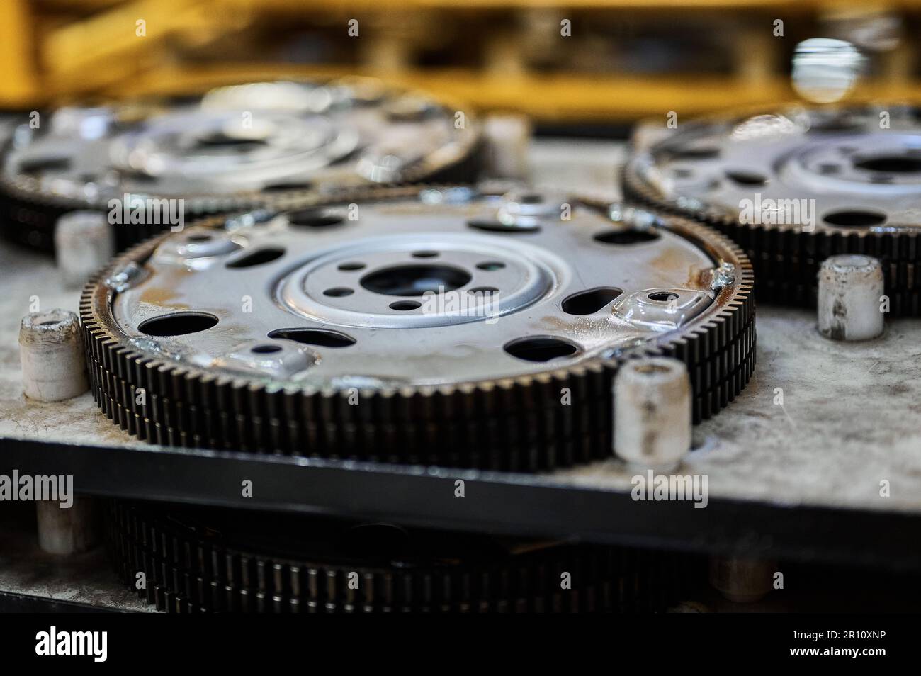 Car engine flywheels on shelf at auto production factory Stock Photo Alamy