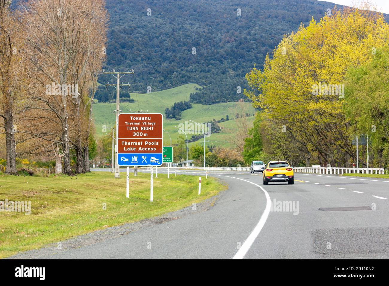 October 25, 2022: Cars traveling on State Highway 1 through Turangi, New Zealand in spring. Stock Photo