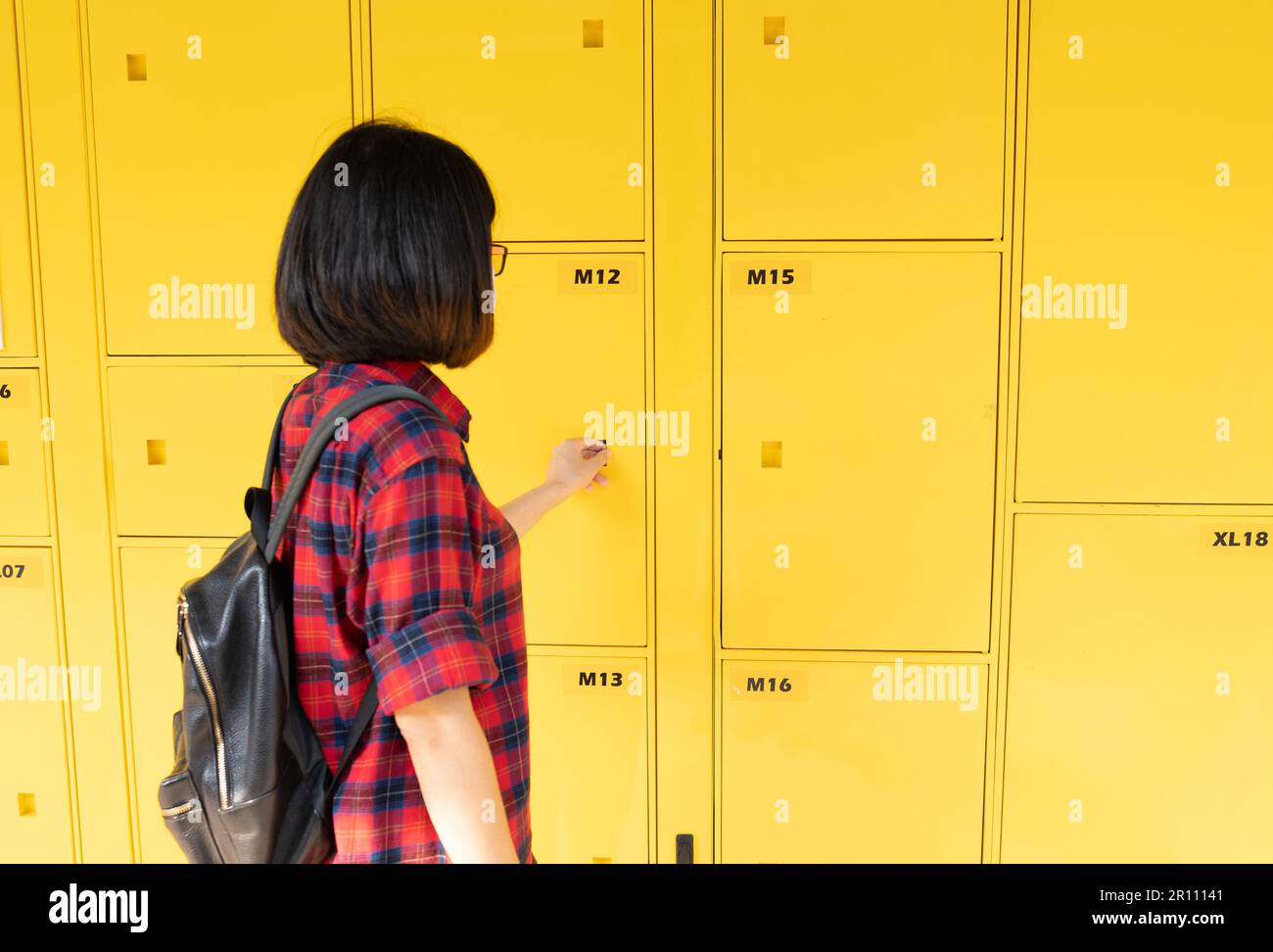 Selfservice storage locker. Tourist uses the service of automated