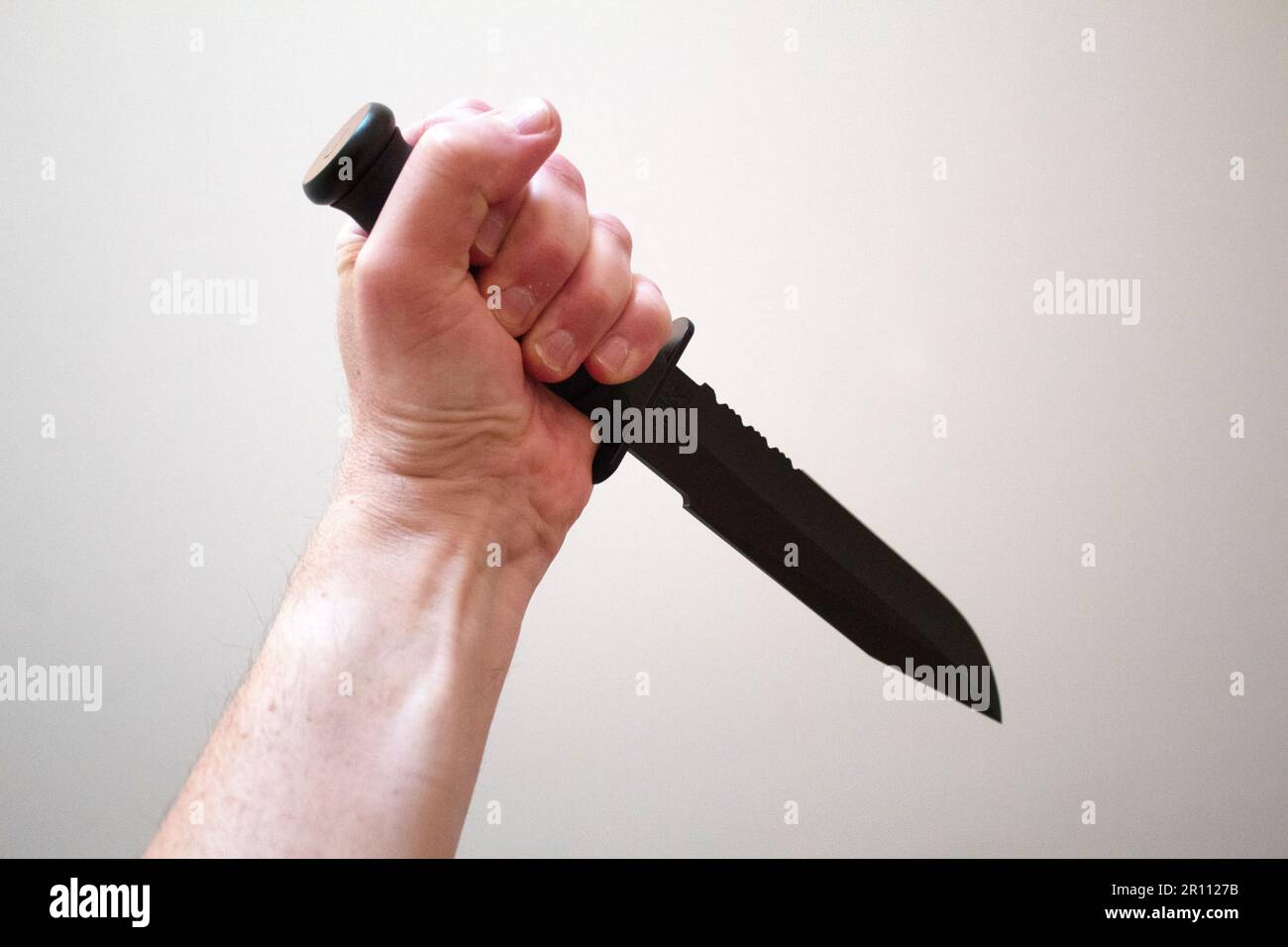 Hand with knife Stock Photo Alamy