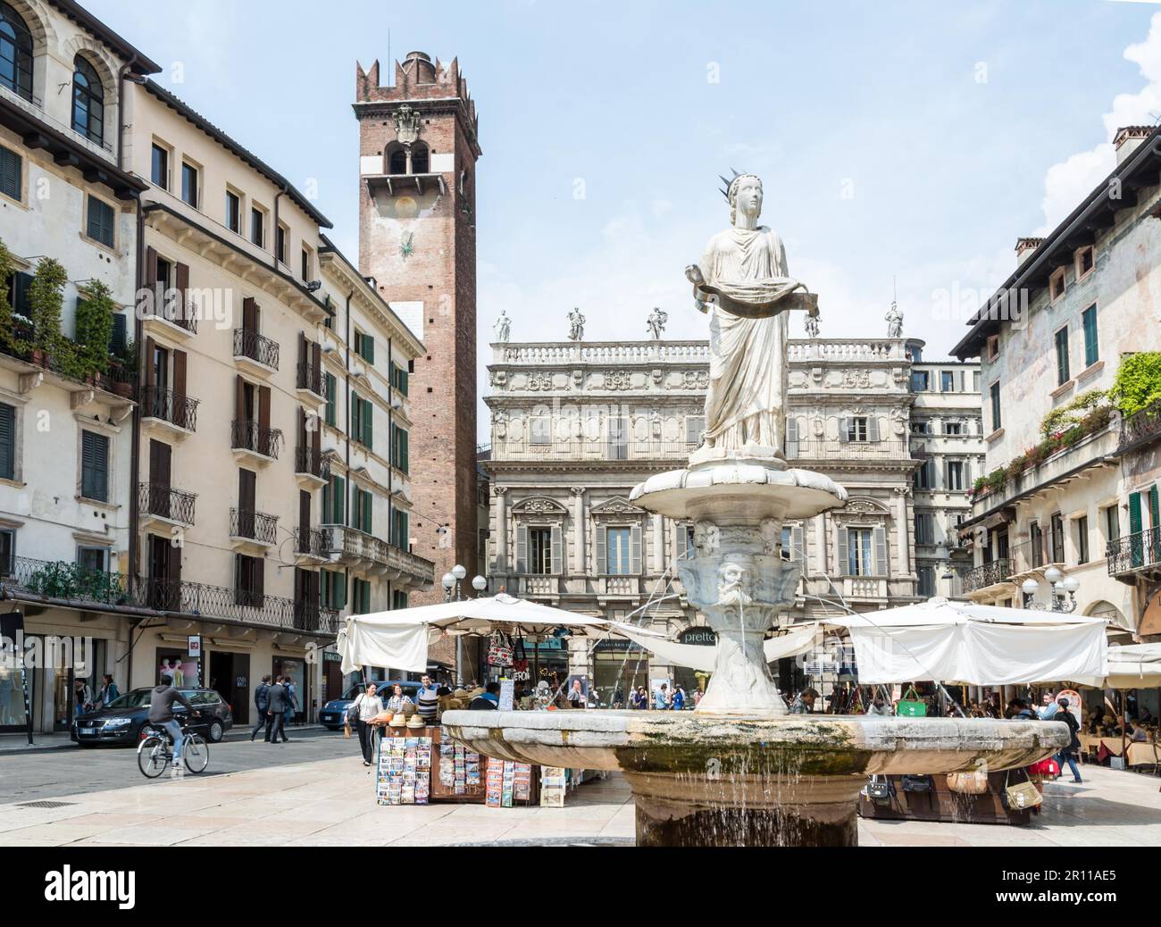 VERONA, ITALY, APRIL 23: Tourists at the historic center of Verona, Italy, April 23, 2014. Verona is famous for its ancient amphitheatre which could Stock Photo