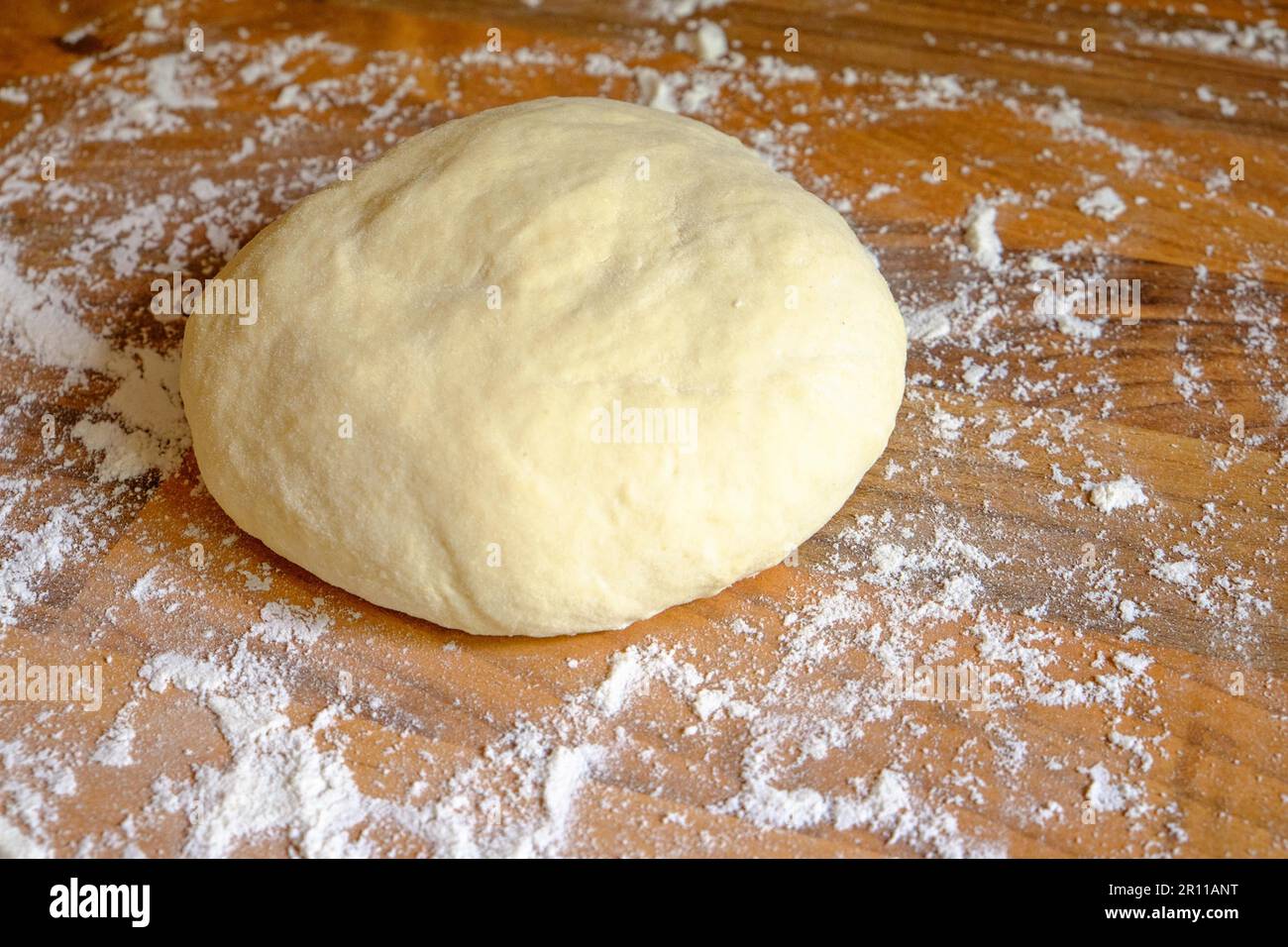 One scoop of homemade pizza dough, ready to roll out Stock Photo