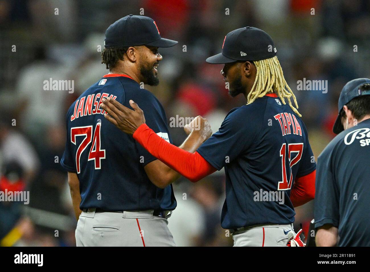 ATLANTA, GA – MAY 10: Boston relief pitcher Kenley Jansen (74) is  congratulated by teammate Raimel Tapia (17) following the conclusion of the  MLB game between the Boston Red Sox and the