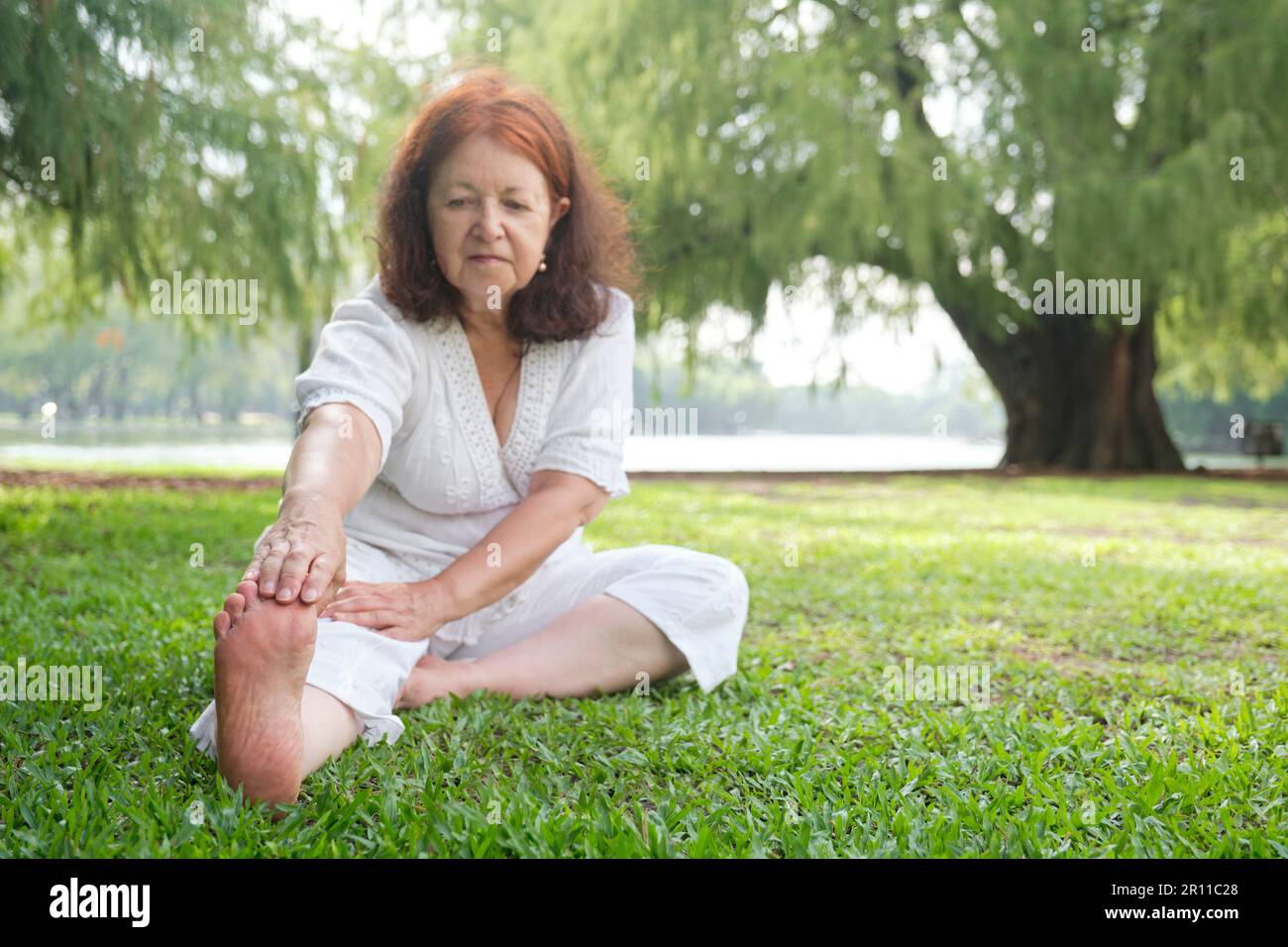 Mature woman barefoot outdoors hi-res stock photography and images - Alamy