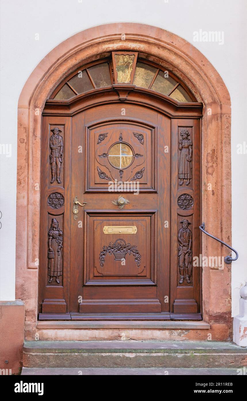 old wooden door in a brick wall Stock Photo