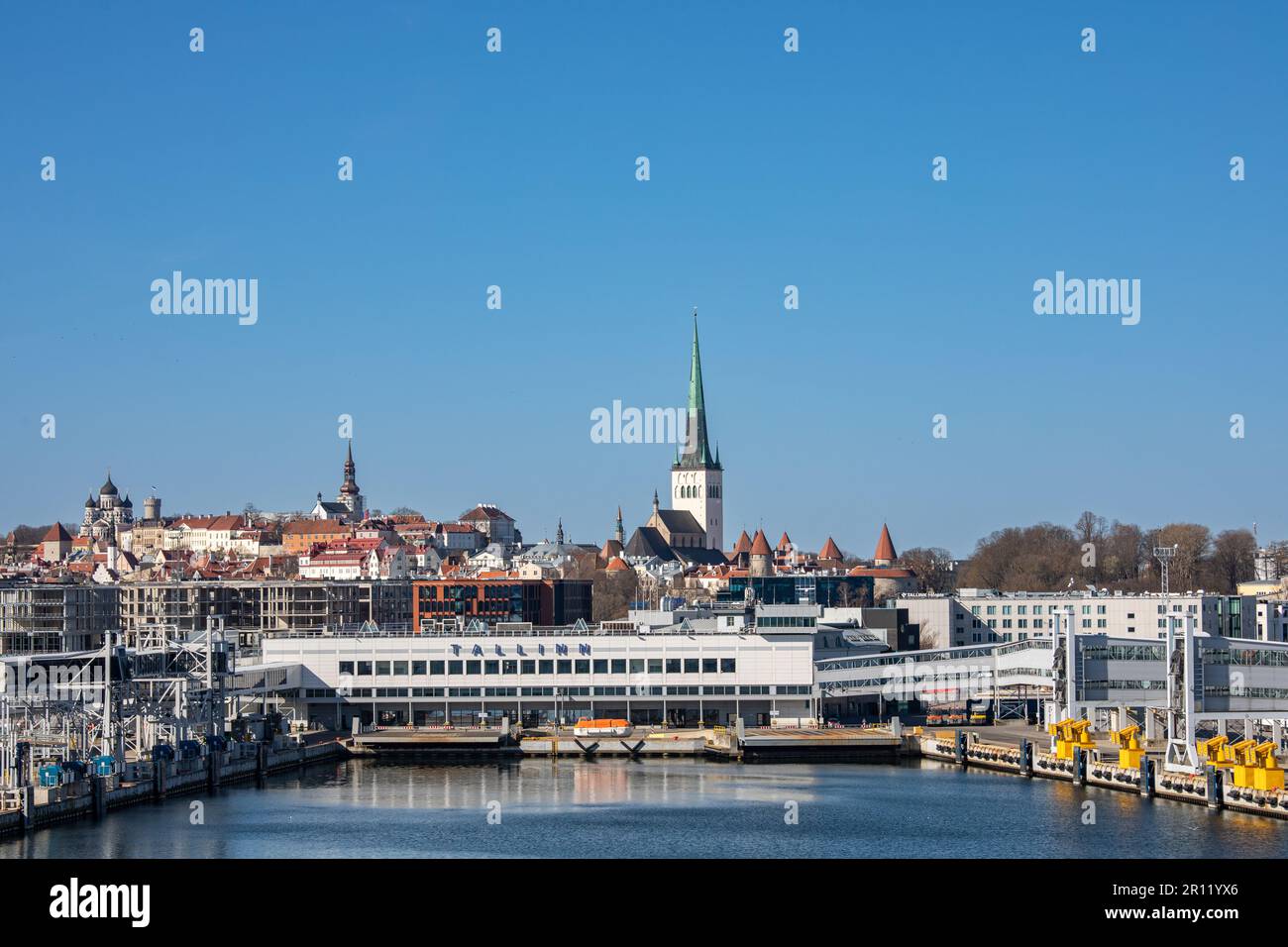 Terminal A of passenger harbor with old town skyline against clear blue sky in Port of Tallinn, Estonia Stock Photo