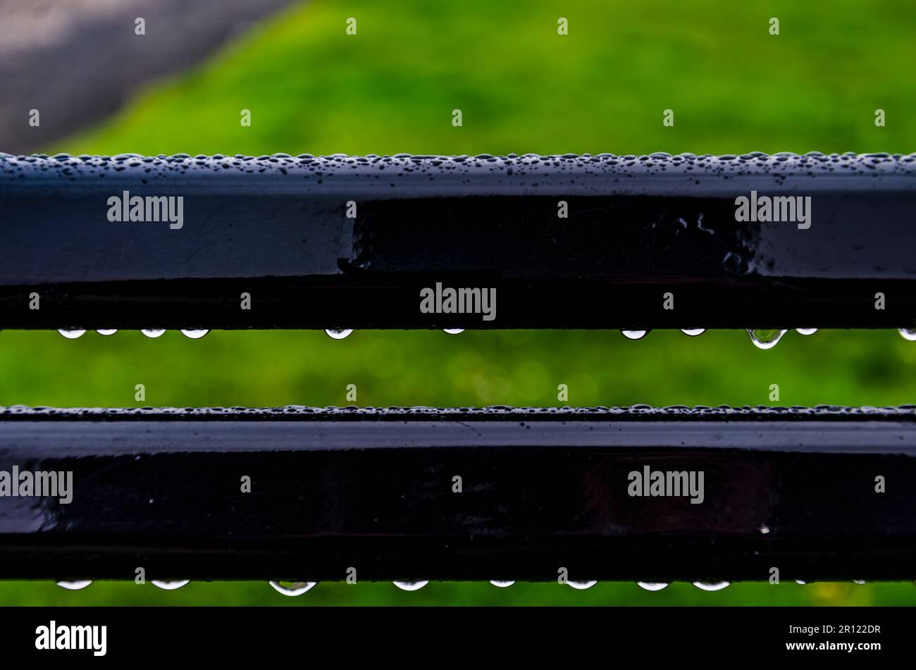 Close up of rain drops on a public bench at Seapark County Down Northern Ireland Stock Photo
