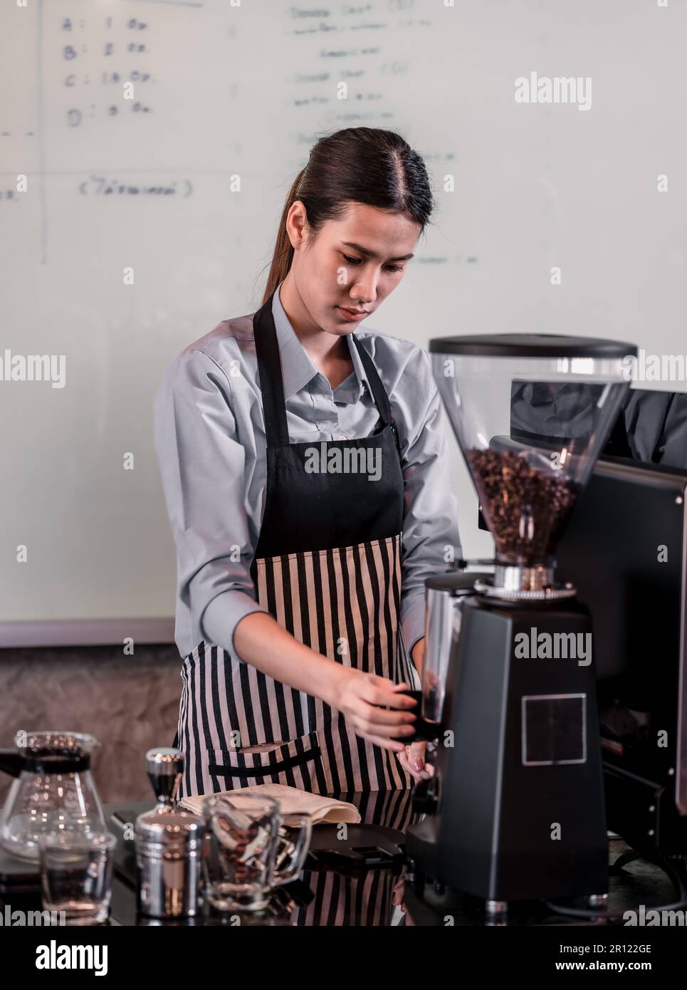 Young adult coffee makers work with skilled baristas to create menus