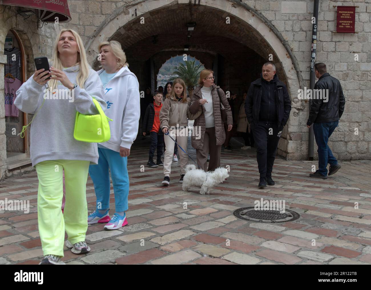 Kotor Montenegro, Apr 9, 2023: Tourists entering Old Town through the arched Marine Gate Stock Photo