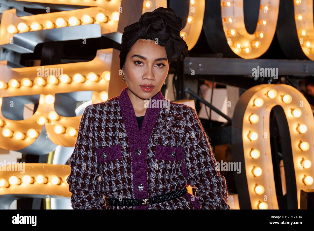 Yuna arrives at the Chanel Cruise 2022/2023 Fashion Show on