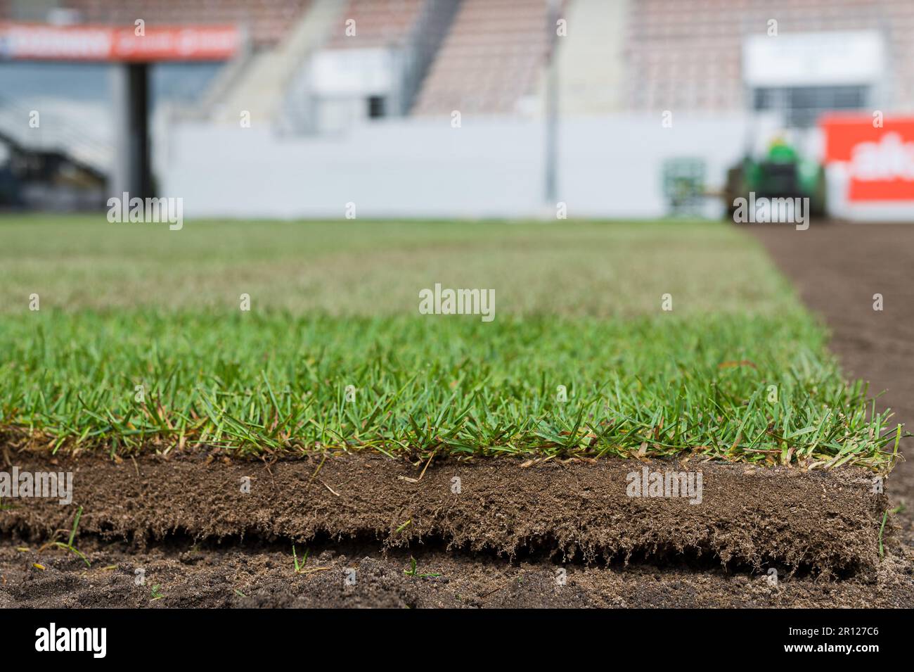 A piece of new grass from a roll laying on a football pitch. Stock Photo