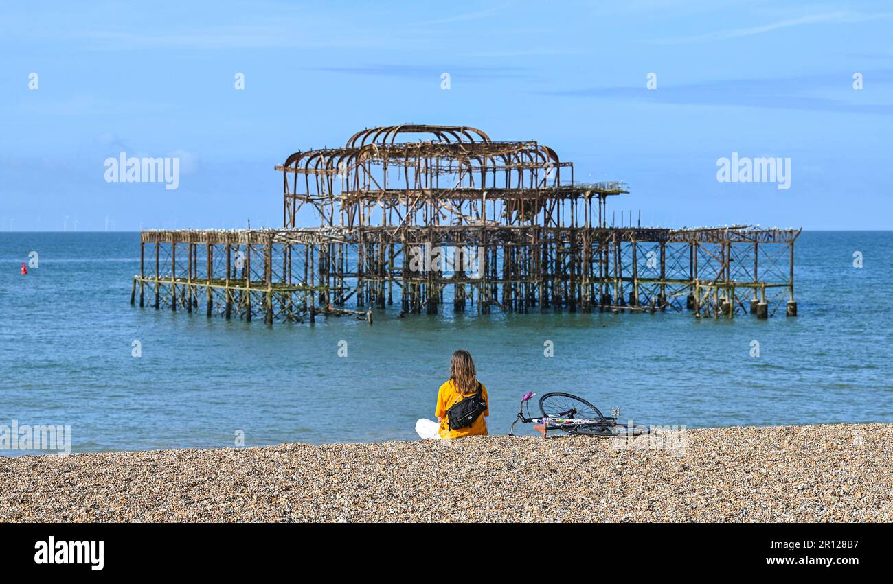 Brighton UK 11th May 2023 - It's a beautiful sunny morning by the West Pier in Brighton : Credit Simon Dack / Alamy Live News Stock Photo