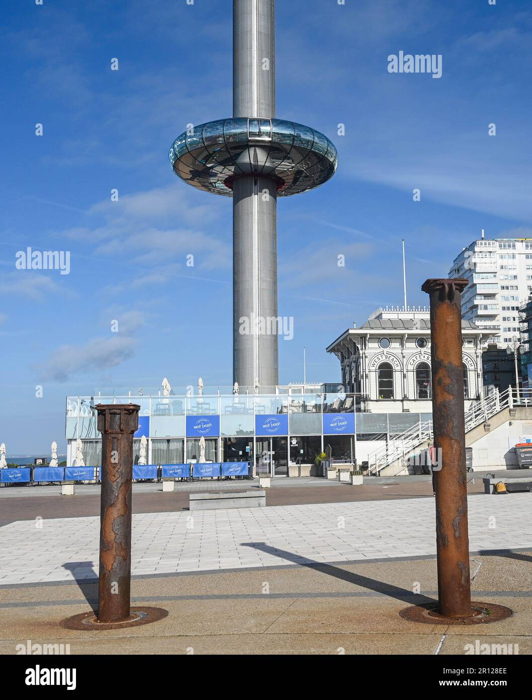 Brighton UK 11th May 2023 - The Brighton i360  rises in the early morning sunshine along the South Coast : Credit Simon Dack / Alamy Live News Stock Photo