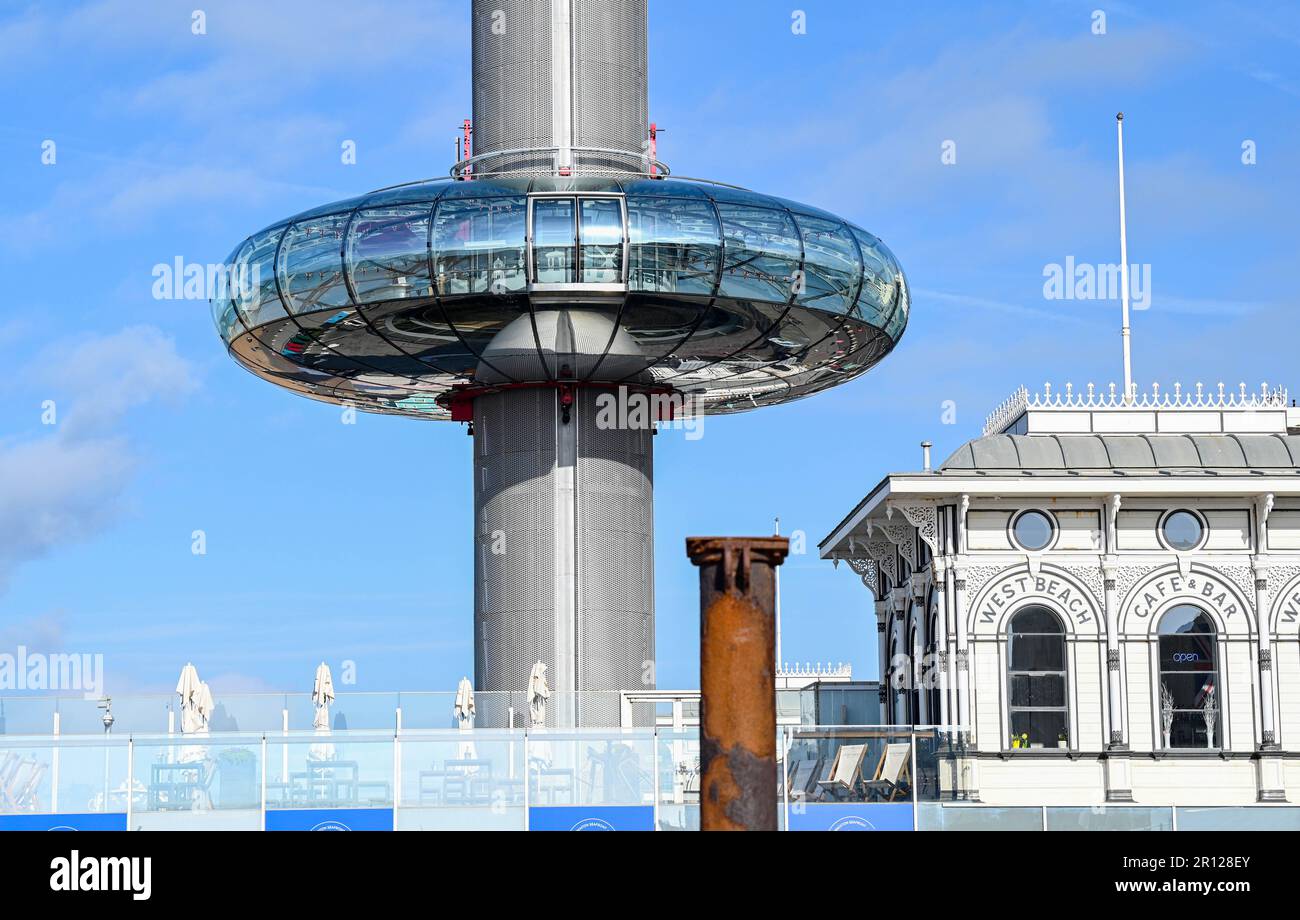 Brighton UK 11th May 2023 - The Brighton i360  rises in the early morning sunshine along the South Coast : Credit Simon Dack / Alamy Live News Stock Photo