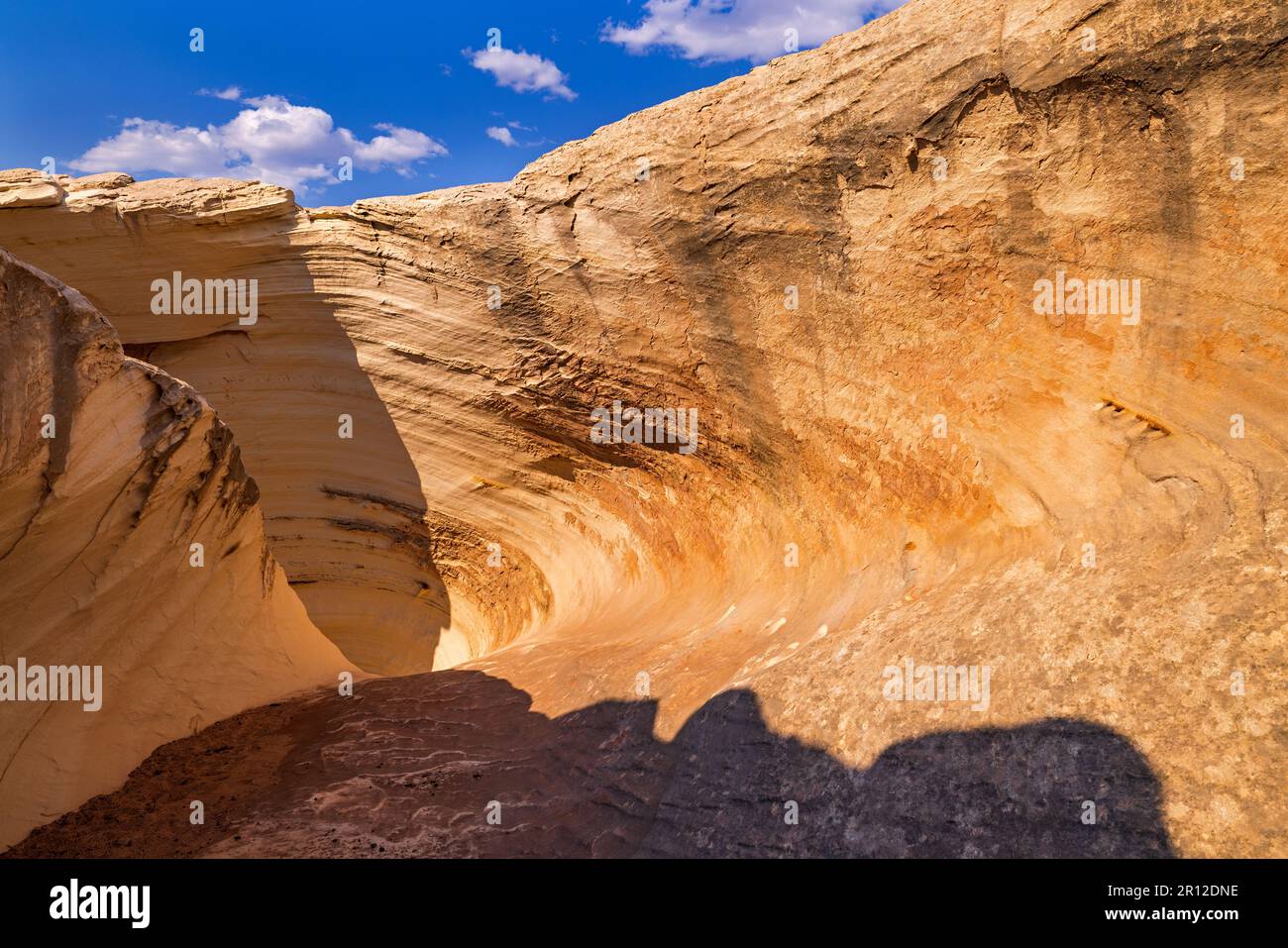 Looking down into the large funnel-like shape of The Nautilus that goes out the bottom on the other side, Grand Staircase-Escalante NM, Utah, USA. Stock Photo