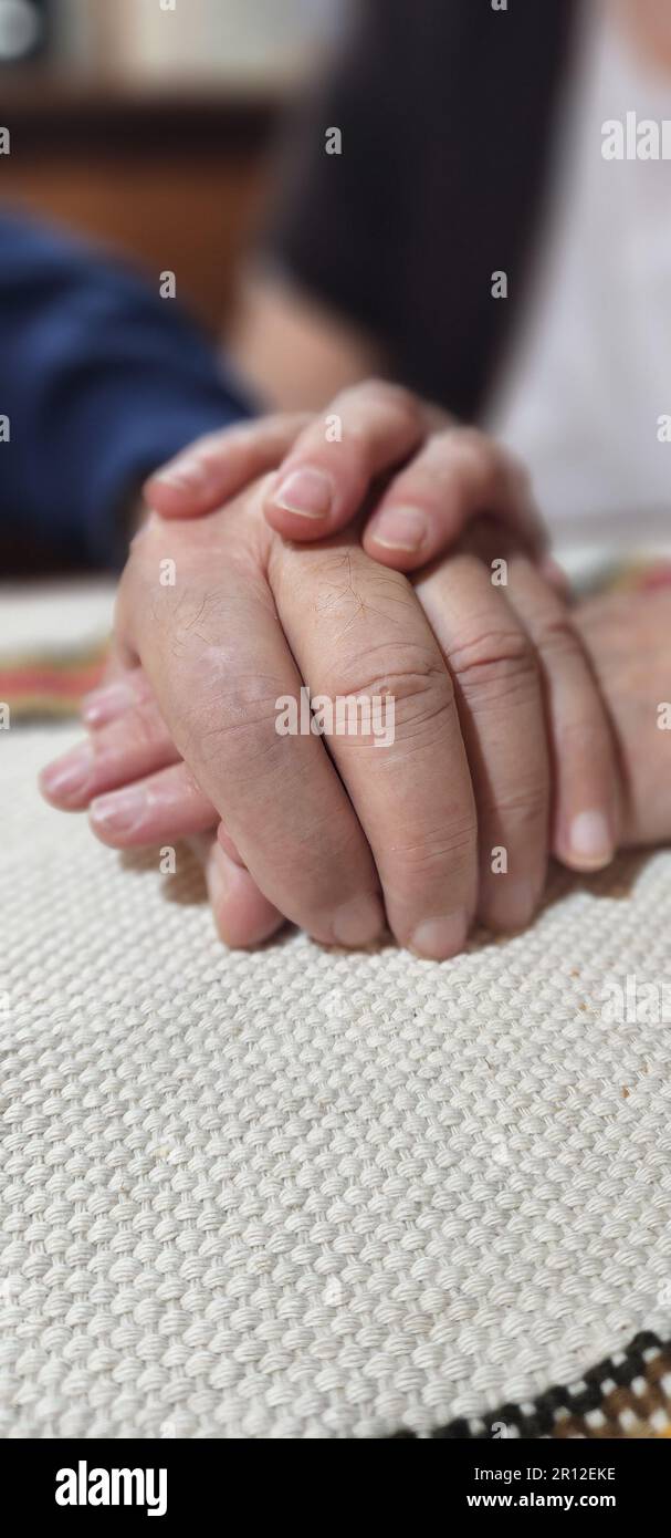 Closeup two people holding hi-res stock photography and images - Alamy