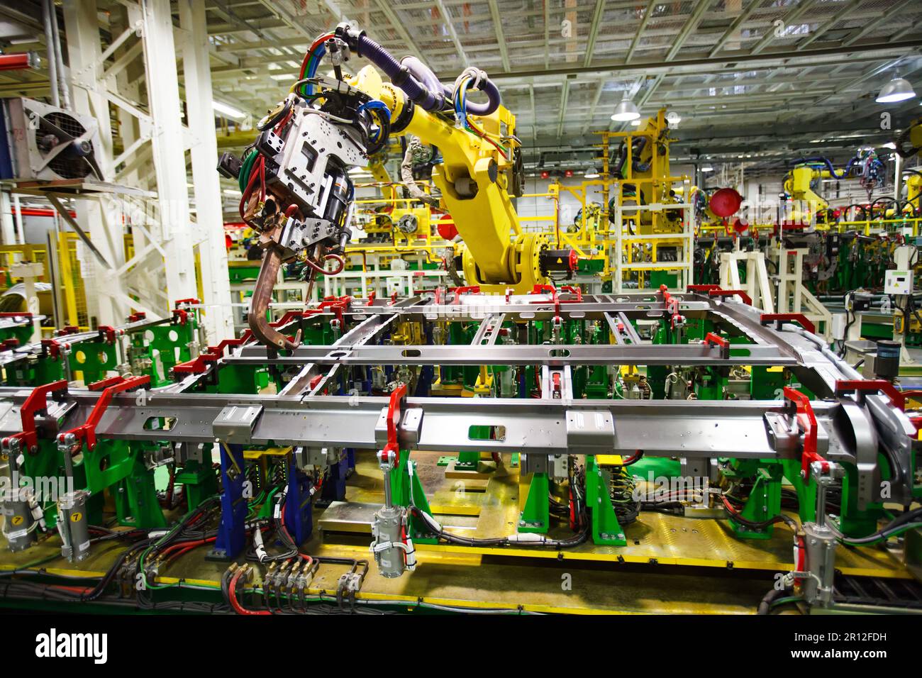 Nizhny Novgorod, Russia - November 21, 2020: GAZ car production plant. Automatic welding line. Welder robot manipulator. Stock Photo